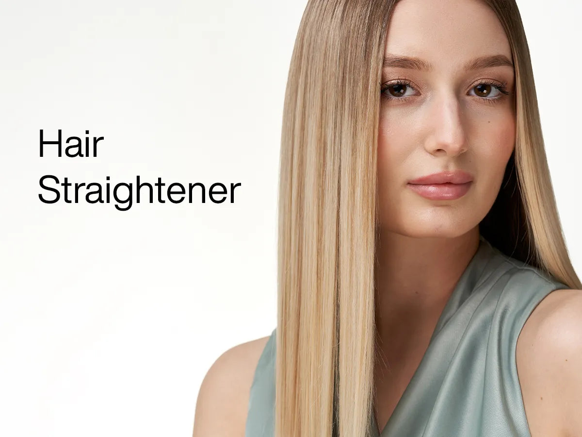 Woman with long straight hair styled smooth after a keratin treatment, viewed from behind