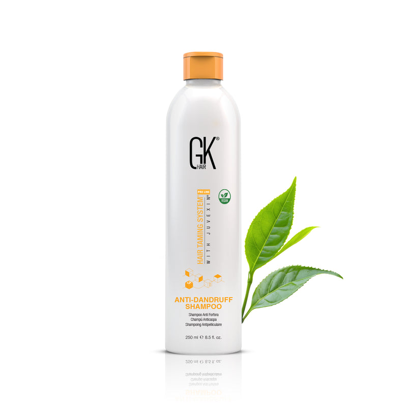 GK Hair Anti-Dandruff Shampoo 250 ml bottle with orange cap, front view with vegan badge and green tea leaves