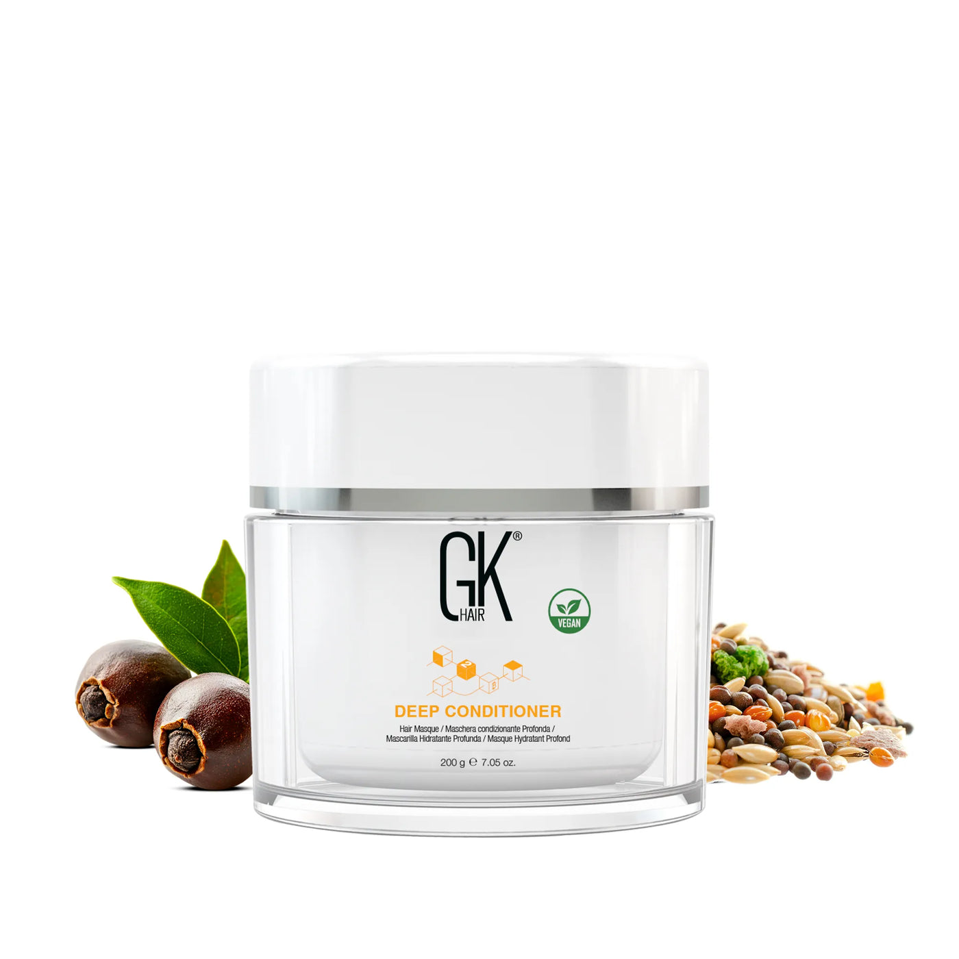GK Hair Deep Conditioner hair masque 200 g jar with vegan badge, beside jojoba nuts, leaves and seeds on white